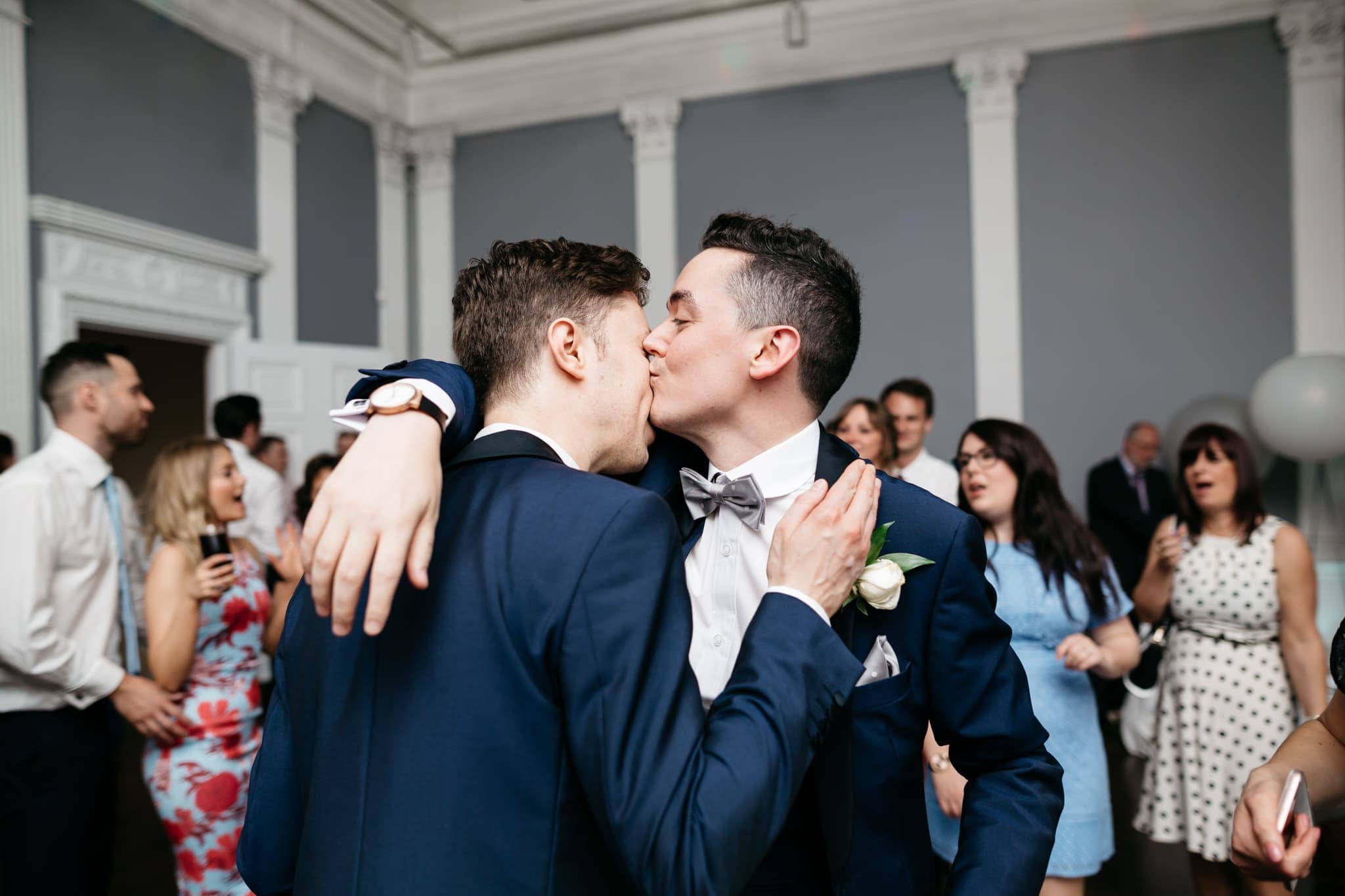 Same sex grooms dancing
